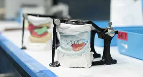 Dentures being manufactured